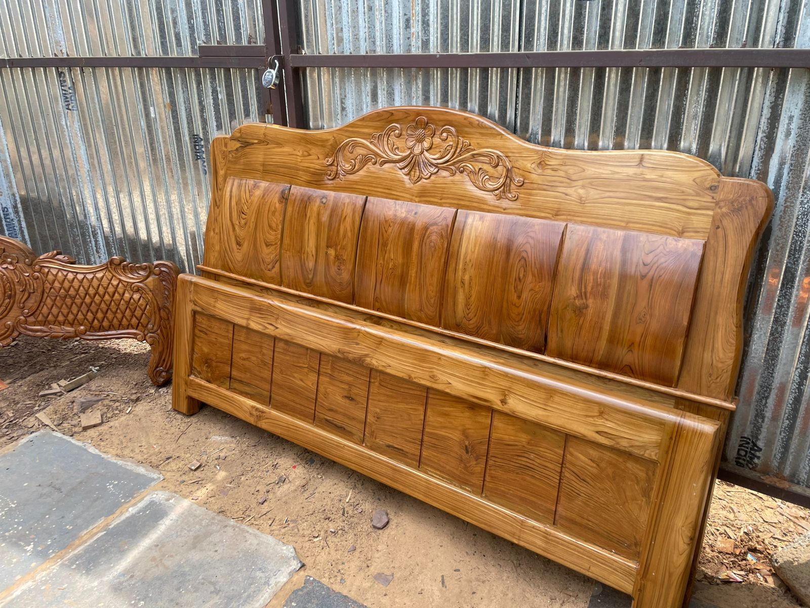 Intricately carved teak wood bed headboard